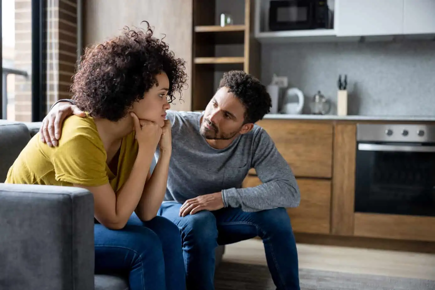 man kindly talking to his sister about a worrisome topic