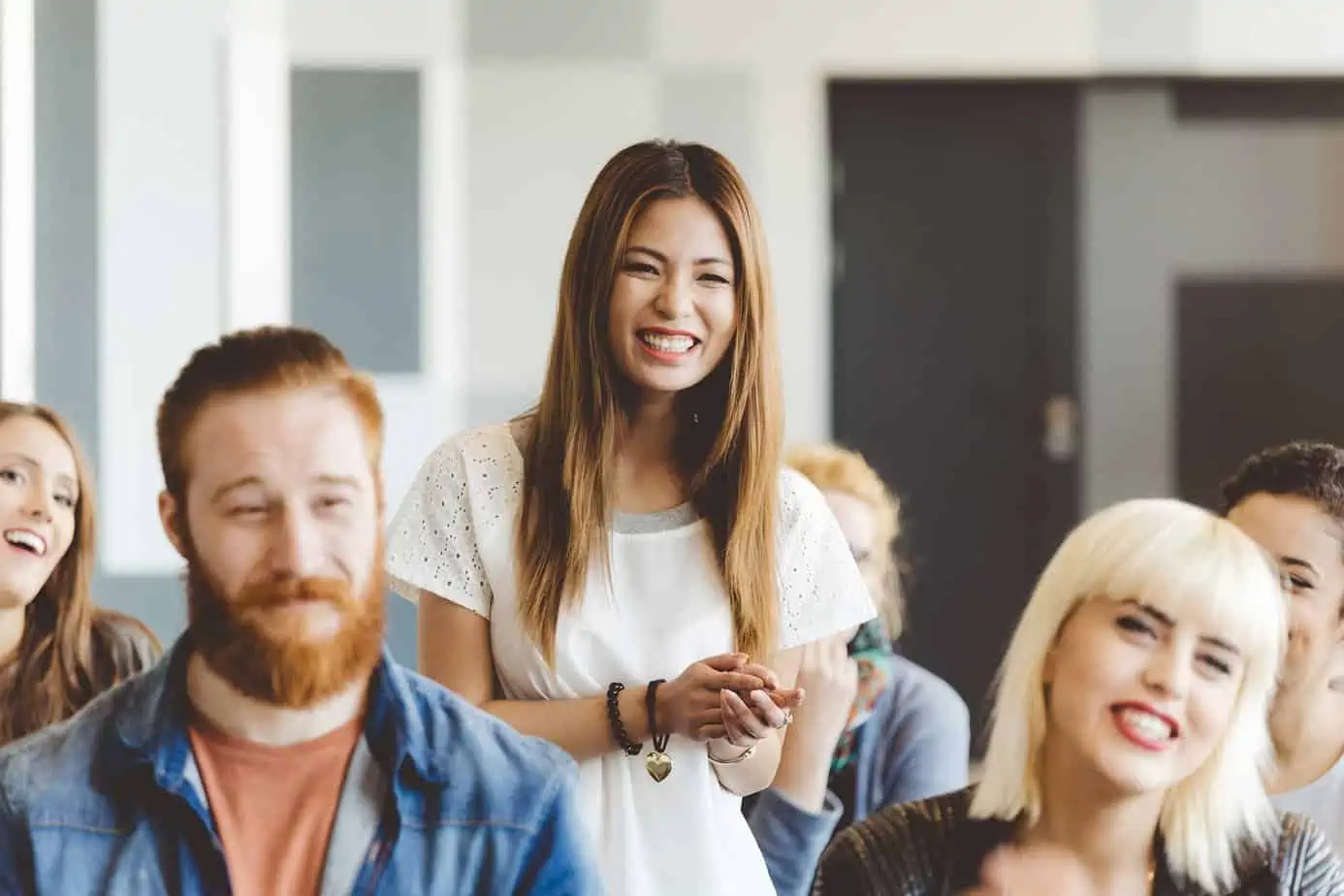 Asian woman speaking in a recovery support group.