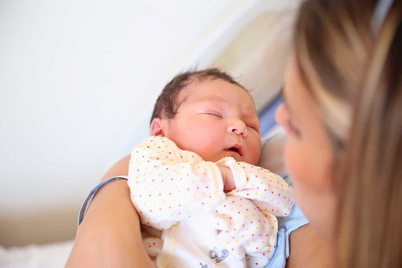 Mother holds an infant born with neonatal abstinence syndrome (NAS)