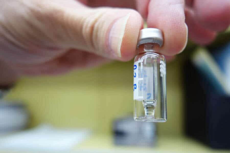 hand holding bottle of carfentanil