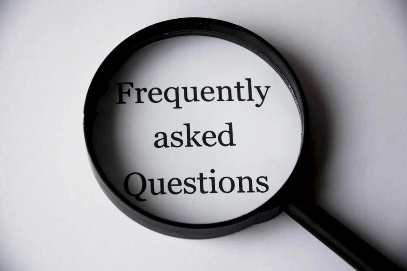 magnifying glass looking up frequently asked questions