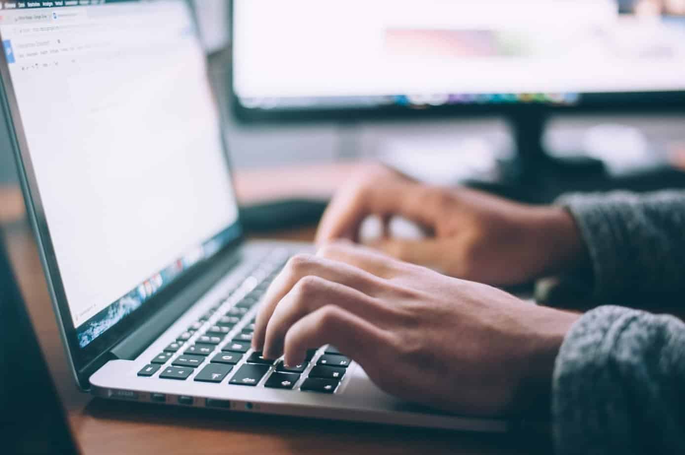 Man attending a virtual addiction recovery support group on a computer.