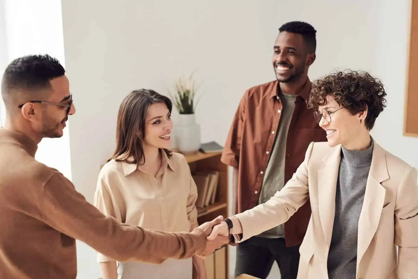 A group of people meeting for the first time, shaking hands