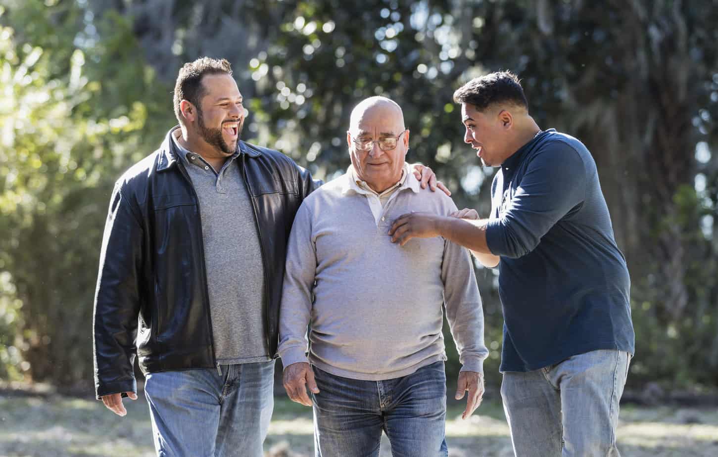 group of various aged men walking the grounds of sober living home