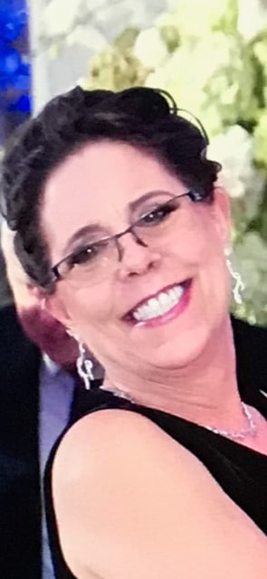 smiling woman in glasses