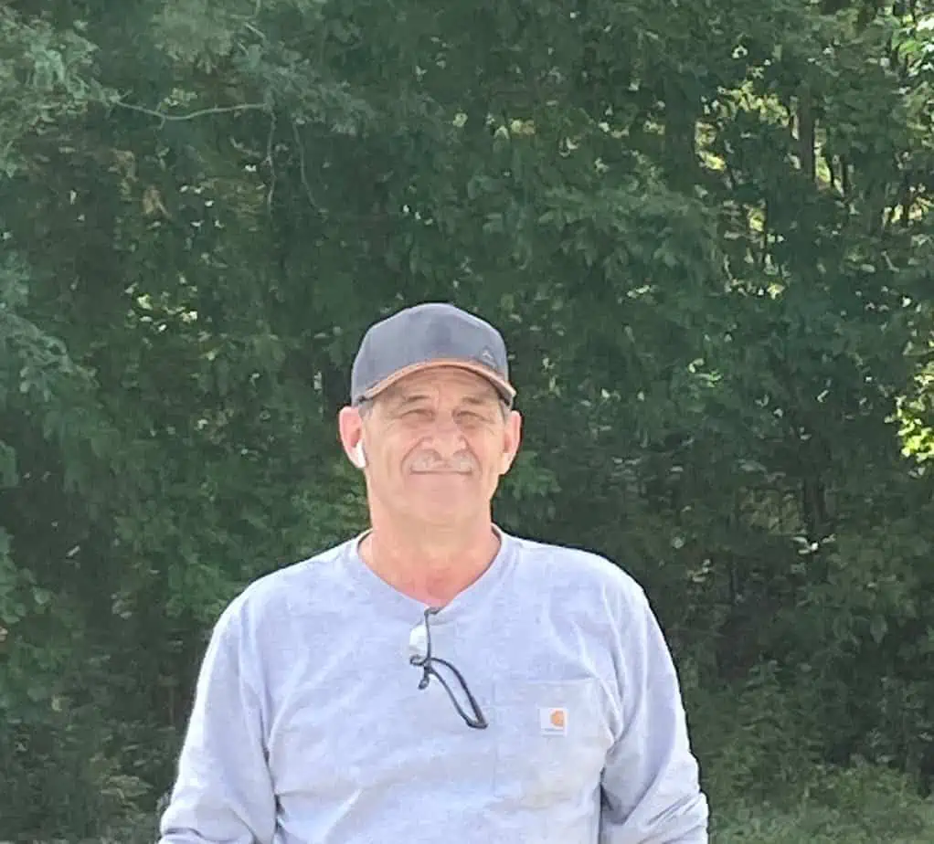 smiling older man in backyard