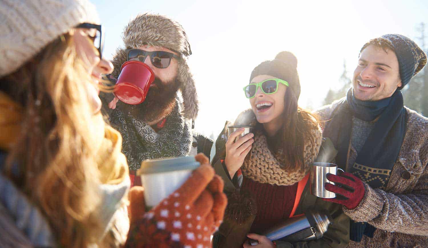 friends enjoying winter fun in warm clothing