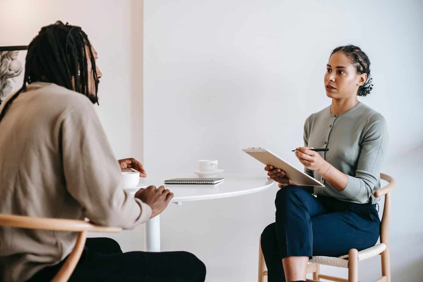 Two people talking in a counseling session.
