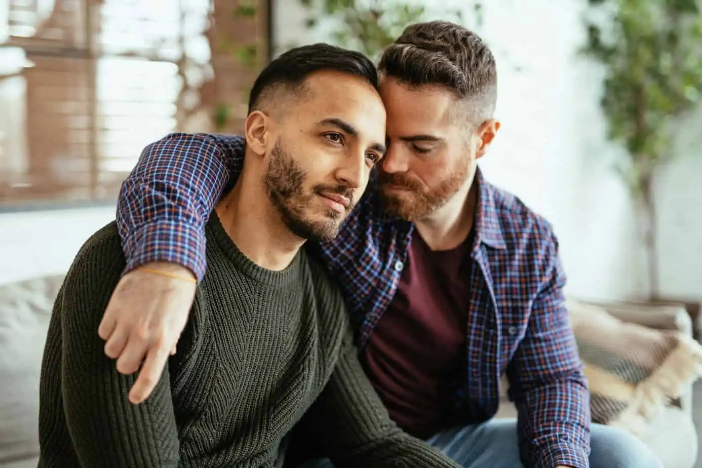 two partners supporting each other putting his arm around his shoulder