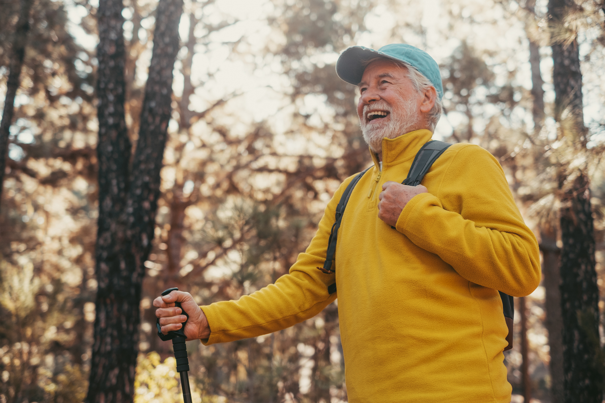 man in yellow shirt engaging in exercise outdoors in recovery