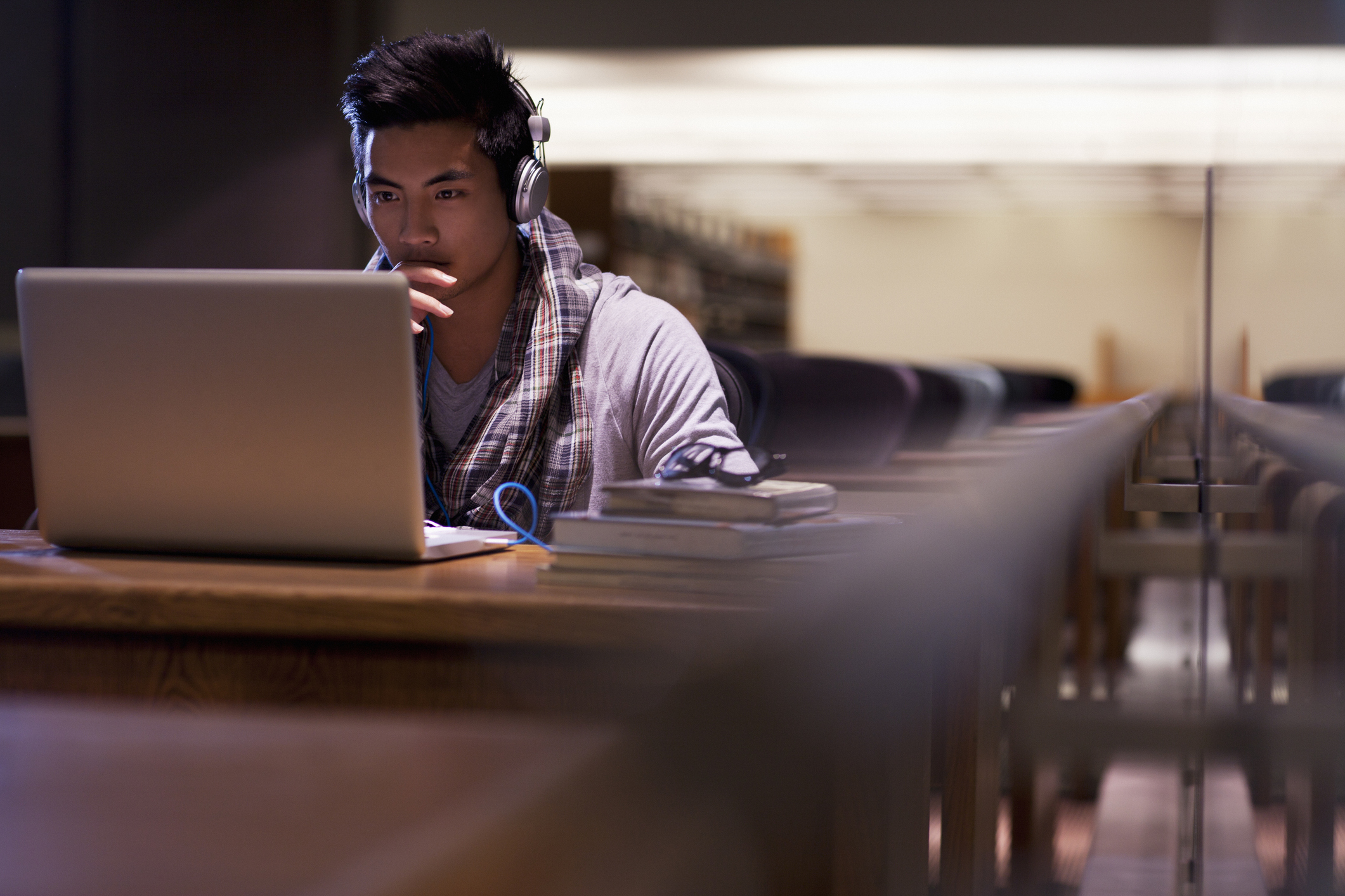 neurodiverse man working in library while struggling with addiction