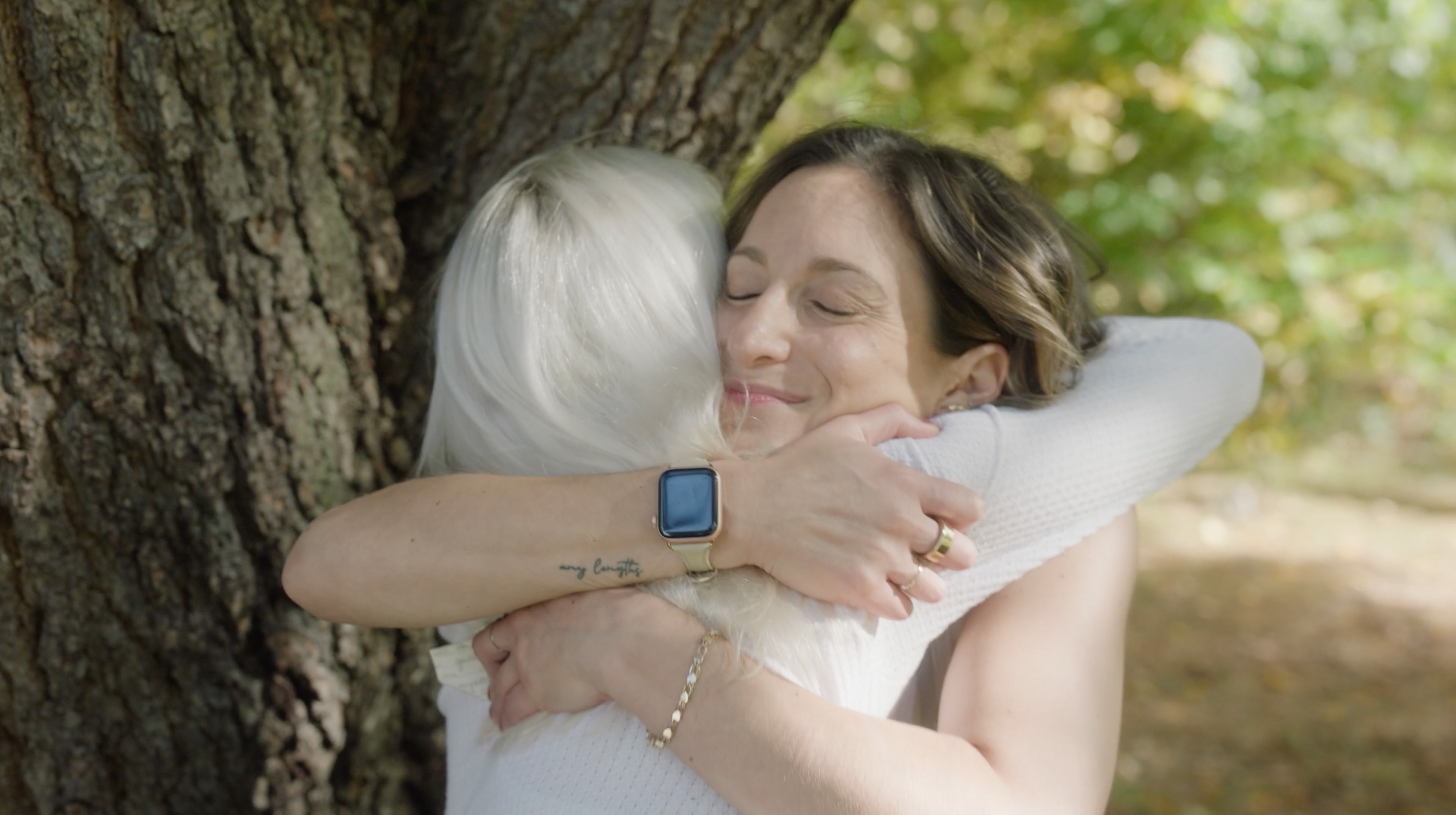 psa film still of rachel hugging a woman