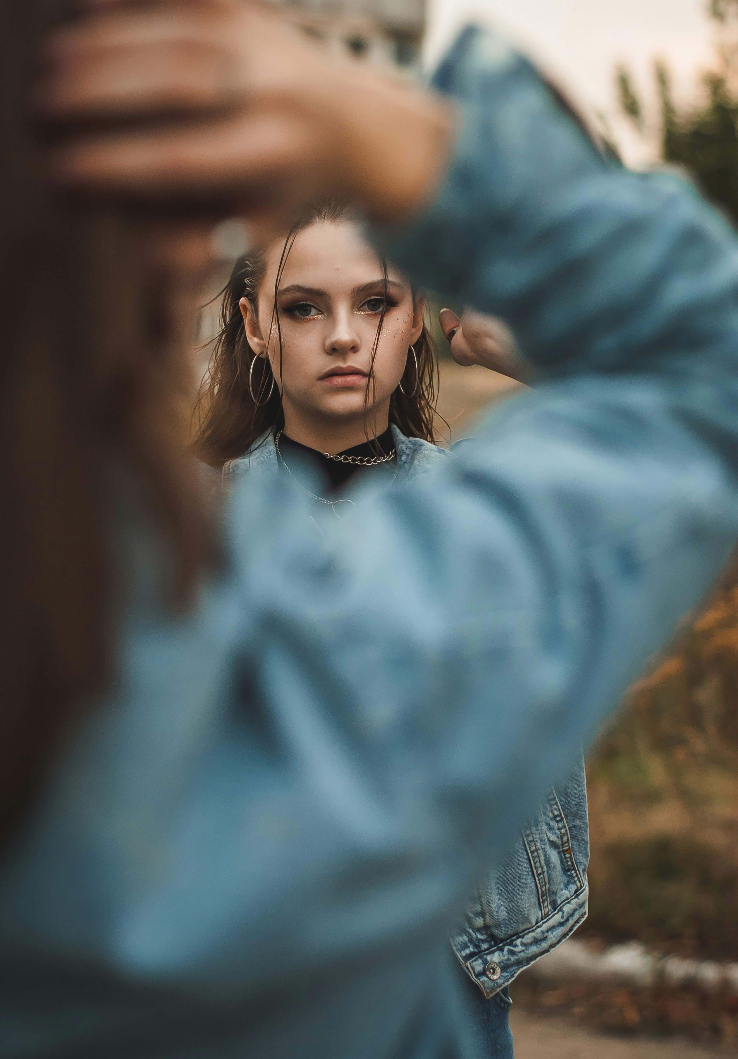 teen struggling with substance abuse standing near a tree