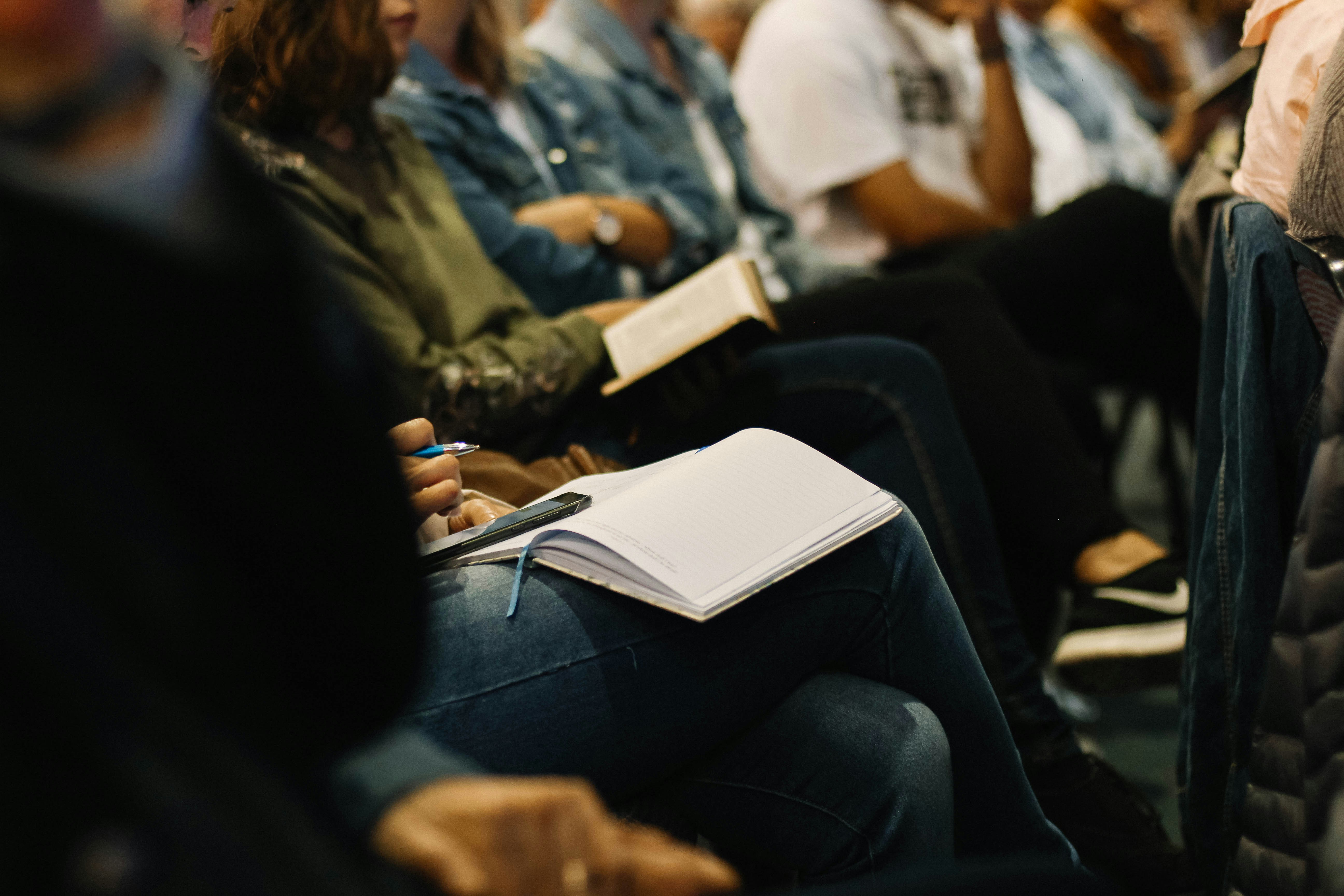 Group of people at an AA meeting discussing Steps 10 through 12