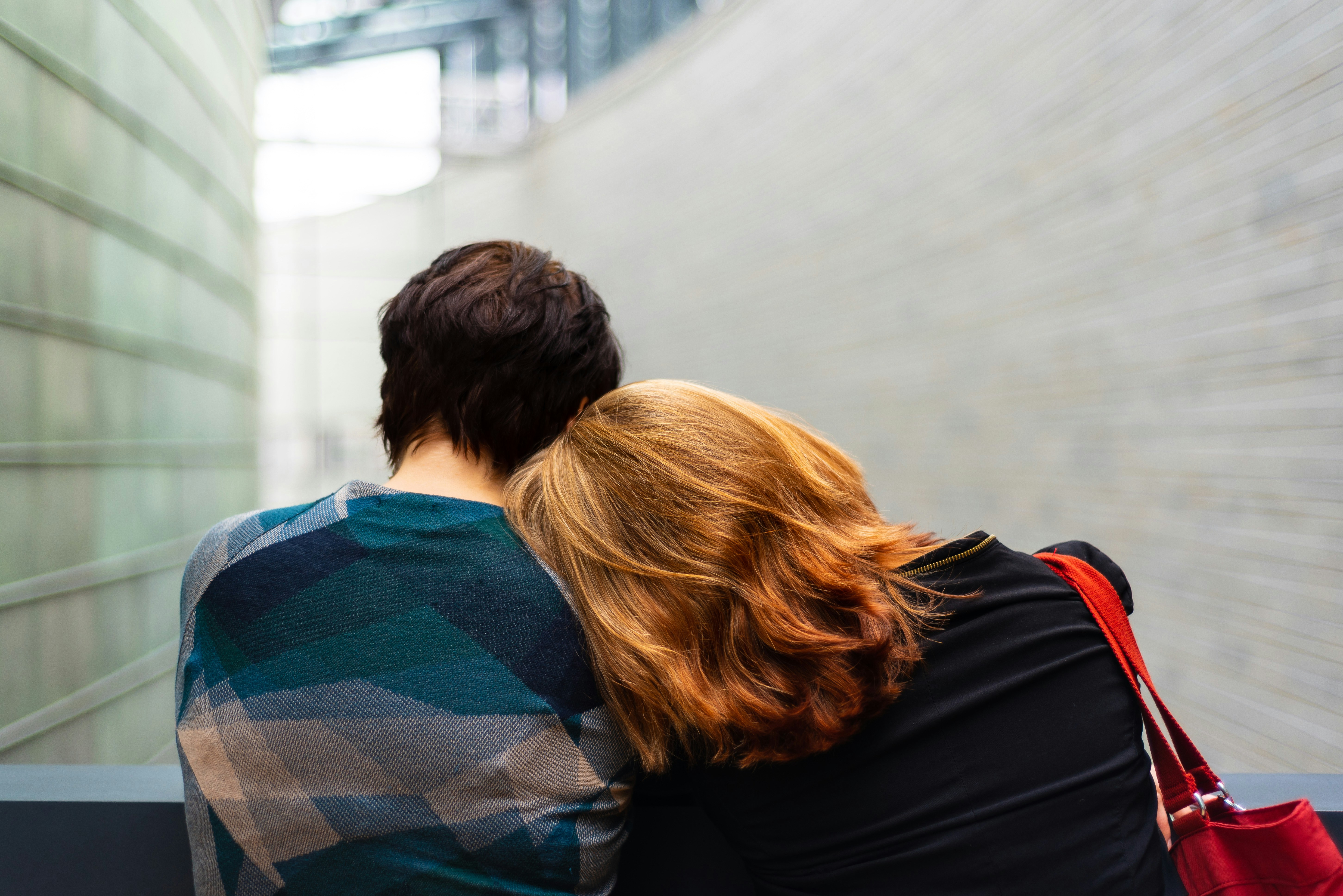 A mother comforts her teenage son with PTSD